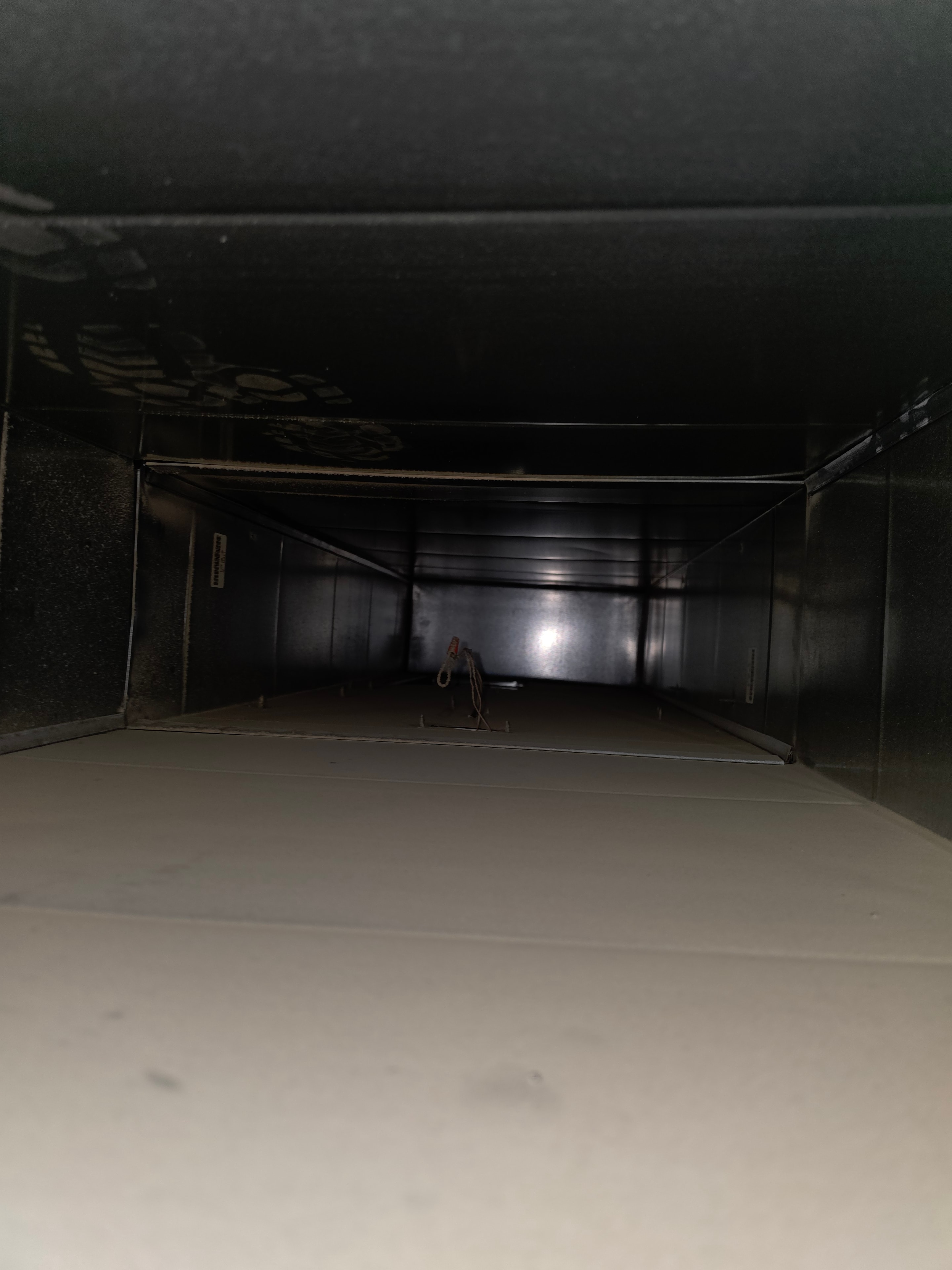 Main duct trunk dark with years of buildup — Summit NJ before cleaning